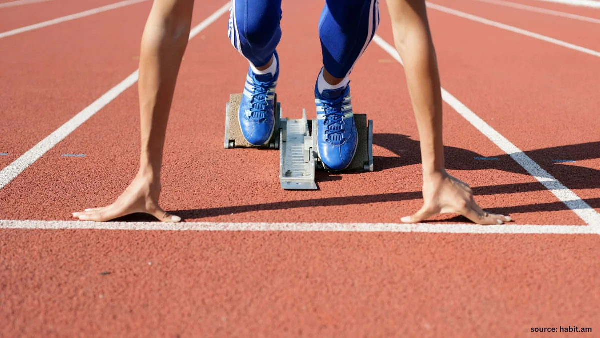 A runner at the starting blocks, symbolizing the small first step of building a consistent journaling habit